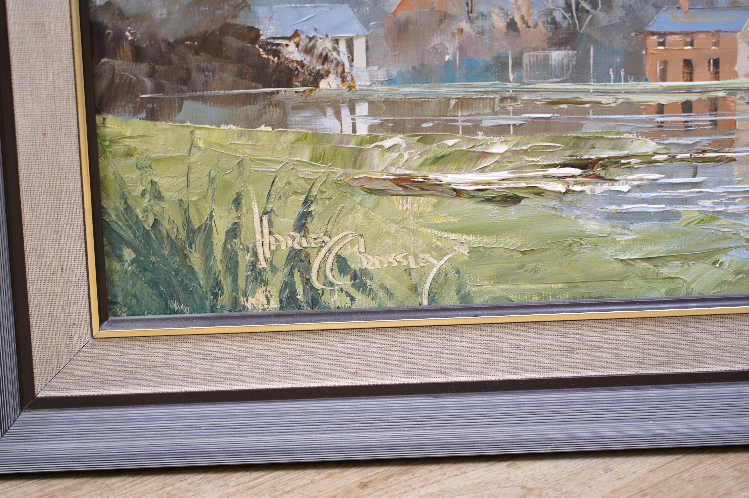 Harley Crossley (b.1936), impasto oil on board, Riverscape with church, signed, 29 x 69cm. Condition - good